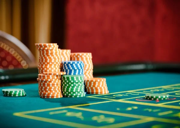 Multi-camera live dealer studio with roulette and baccarat tables